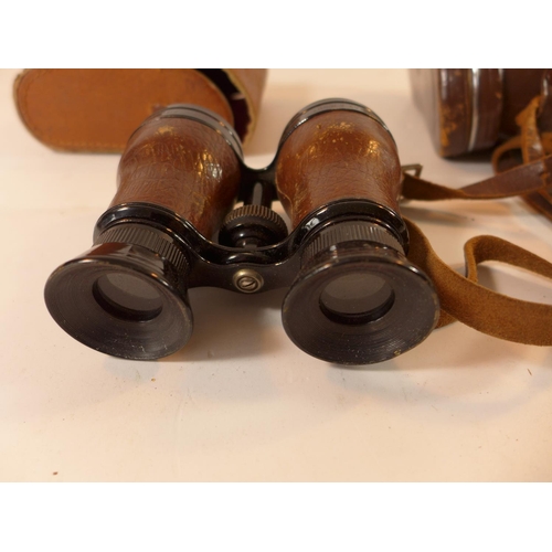 490 - A PAIR OF 1941 TAYLOR-HOBSON X 2 BINOCULARS AND WEBBING CASE, ANOTHER PAIR OF BINOCULARS AND A SPARE... 