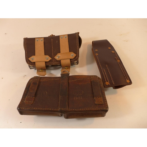 493 - AN OLD LEATHER AMMUNITION POUCH, FURTHER POUCH AND A FROG (3)