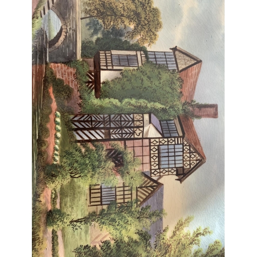 719 - A FRAMED OVAL CERAMIC PLAQUE OF LITTLE MORETON HALL BY JOHN THORLEY