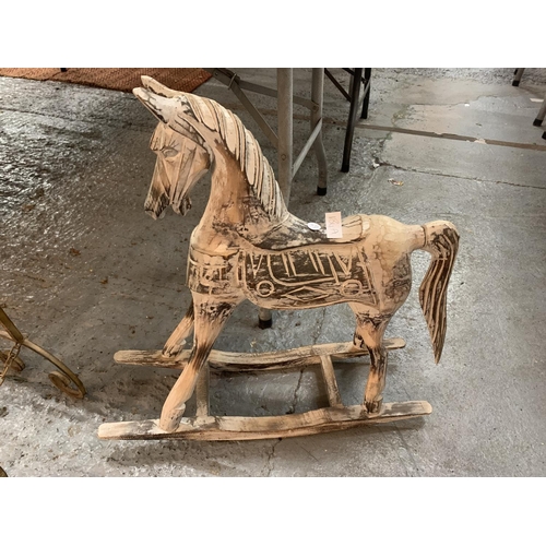 134A - A SMALL WOODEN ROCKING HORSE FOR DECORATION PURPOSES