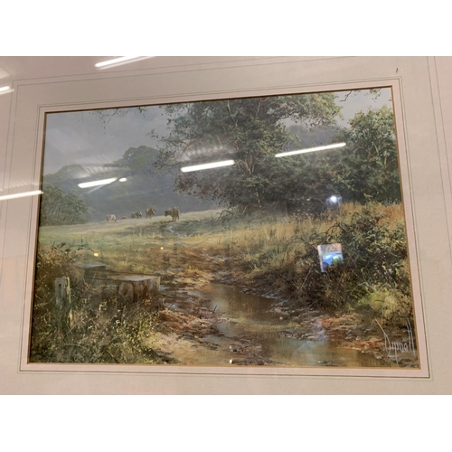 292 - A FRAMED PRINT DEPICTING CATTLE BY A STREAM