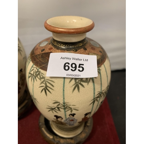 695 - A PAIR OF DECORATIVE SATSUMA VASES (ONE CHIPPED TO THE RIM) WITH A PAIR OF WOODEN BASES  H:16CM