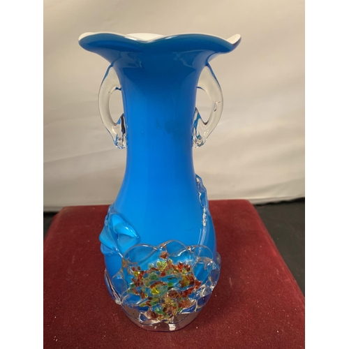 734 - A SMALL COLOURED GLASS VASE WITH TWIN HANDLES AND FLORAL RELIEF DESIGN H:20CM