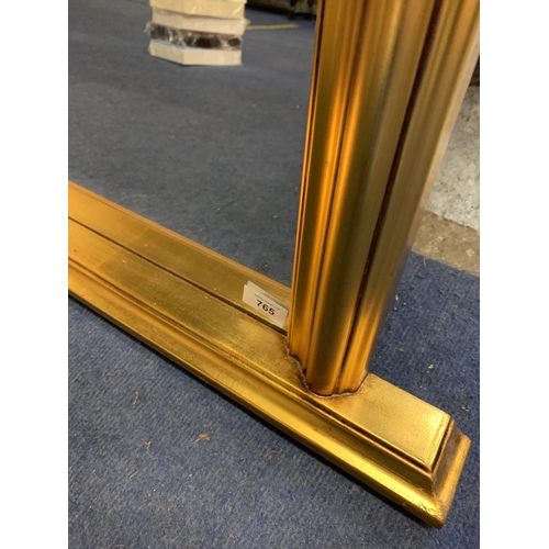 765 - A LARGE GILT FRAMED OVERMANTEL MIRROR