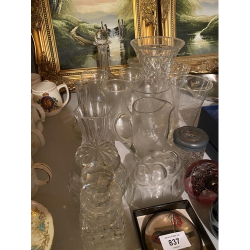 837 - A VARIETY OF GLASSWARE TO INCLUDE A DECANTER, A VASE AND PAPER WEIGHTS ETC