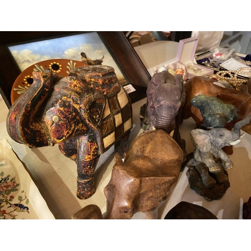 865 - AN ASSORTMENT OF TRIBAL ITEMS TO INCLUDE ELEPHANT ORNAMENTS, A TREEN TRIBAL BUST AND A FRAMED TRIBAL... 