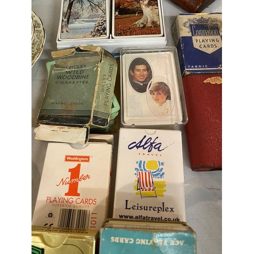 877 - A VARIETY OF DECKS OF CARDS TO ALSO INCLUDE A WHITE METAL CIGARETTE CASE