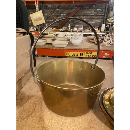 896 - A LARGE BRASS PRESERVING PAN AND A BRASS BEDWARMER