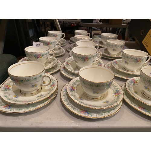 907 - TWELVE H M SUTHERLAND BONE CHINA TRIOS TO INCLUDE A TEA PLATE AND SUGAR BOWL