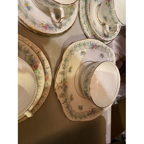 907 - TWELVE H M SUTHERLAND BONE CHINA TRIOS TO INCLUDE A TEA PLATE AND SUGAR BOWL