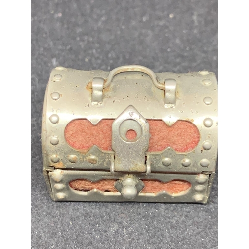 608 - A WHITE METAL MINATURE CHEST CONTAINING A THIMBLE AND THREADS