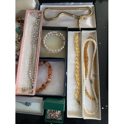 630 - A LARGE QUANTITY OF COSTUME JEWELLERY TO INCLUDE CRYTAL NECKLACES, YELLOW METAL CHAINS, BROOCHES, EA... 