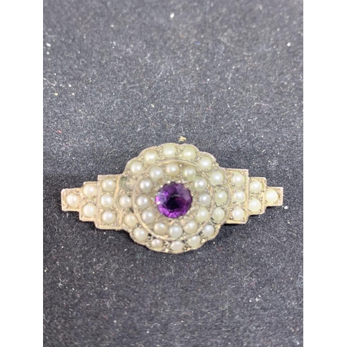 631 - AN ART DECO STYLE MARKED SILVER BROOCH WITH PEARLS AND PURPLE COLOURED STONE