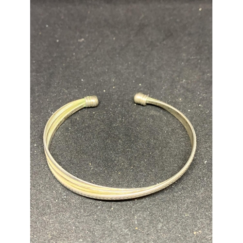 641 - A SILVER BANGLE IN A PRESENTATION BOX