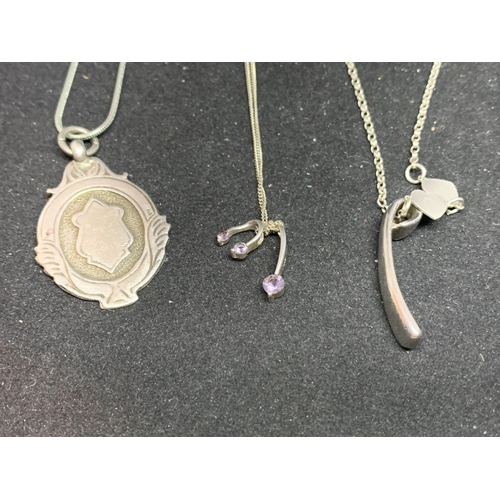 648 - THREE SILVER NECKLACES WITH PENDANTS