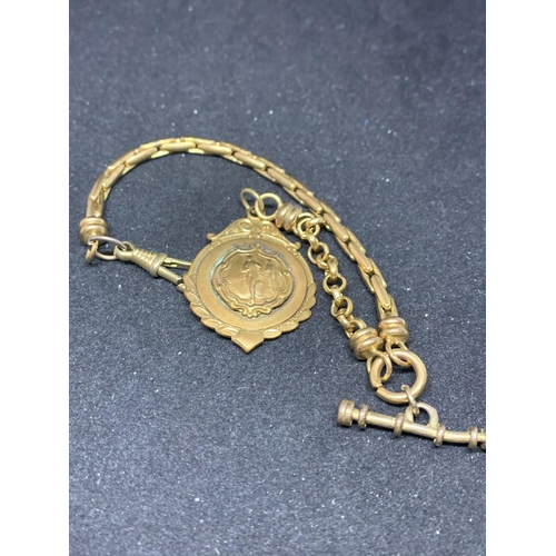 660 - A YELLOW METAL HALF ALBERT WATCH CHAIN WITH A PRESENTAION BOX