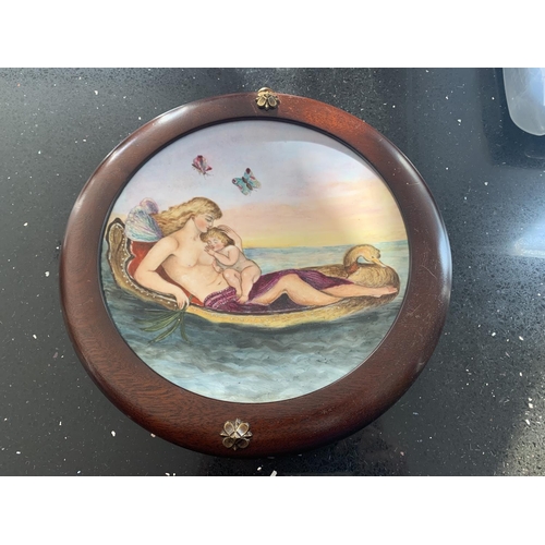 721 - A WOODEN FRAMED CIRCULAR MINTON PLAQUE BY LUCIEN BOULLEMIER OF A MOTHER AND CHILD ON A GONDALA