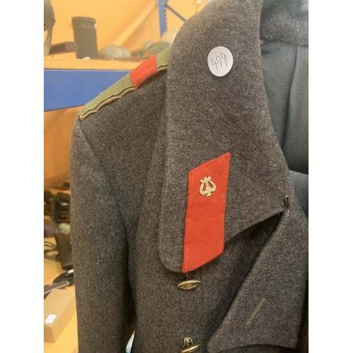 499 - A RUSSIAN SOVIET MILITARY GREAT COAT, TOGETHER WITH A METAL STAND