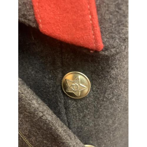 499 - A RUSSIAN SOVIET MILITARY GREAT COAT, TOGETHER WITH A METAL STAND