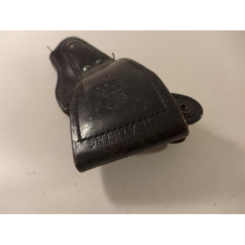 459 - A BLACK LEATHER TRAINING HOLSTER FOR A SMITH & WESSON PISTOL