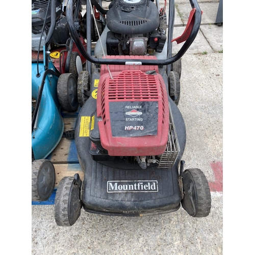 12 - FOUR LAWN MOWERS - A MOUNTFIELD WITH 4.5 HONDA ENGINE, A MOUNTFIELD HP470 WITH B & S ENGINE
A WOLF G... 