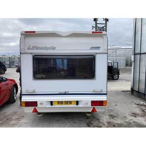 235 - A SWIFT 5 BERTH CARAVAN WITH REFRIGERATOR, COOKER, BLOW HEATER, SHOWER ETC.  - NO VAT