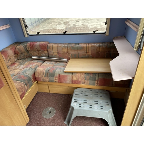 235 - A SWIFT 5 BERTH CARAVAN WITH REFRIGERATOR, COOKER, BLOW HEATER, SHOWER ETC.  - NO VAT