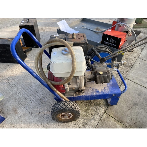 42 - A MOBILE PRESSURE WASHER 6X390 WITH HONDA 130 ENGINE WITH HOSE AND REEL.  - NO VAT