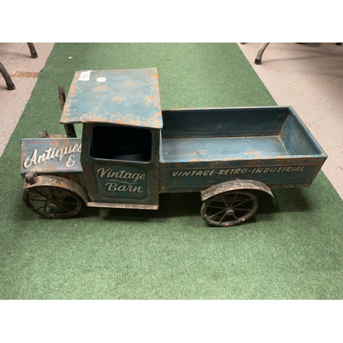 302 - A TIN PLATE VINTAGE STYLE TRUCK - L:67CM H:32CM (TO TOP OF CAB)