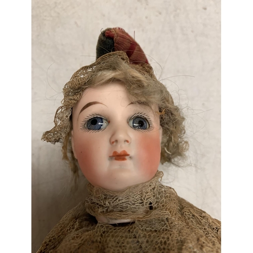 312 - AN EARLY GERMAN BISQUE MUSICAL MAROTTE BY LIMBACH DOLL