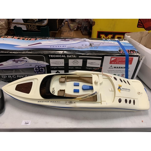 344 - A WICKED CENTURY SUPER POWER RADIO CONTROL RACING BOAT WITH ORIGINAL BOX AND A BOX OF RADIO MODELLER... 