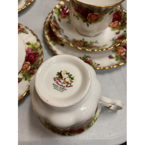 31 - A SELECTION OF ROYAL ALBERT OLD COUNTRY ROSES TEA WARE TO INCLUDE SIX TRIOS, SIX COFFEE MUGS, SANDWI... 