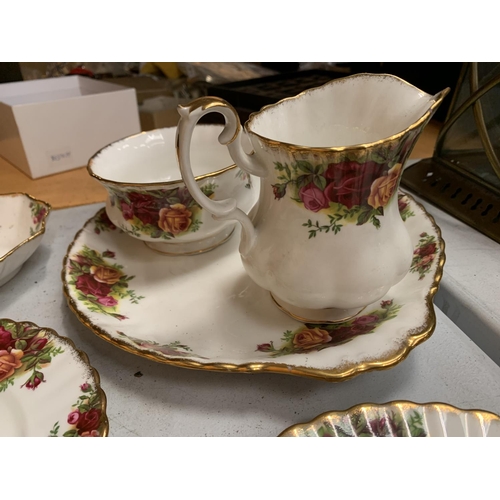 31 - A SELECTION OF ROYAL ALBERT OLD COUNTRY ROSES TEA WARE TO INCLUDE SIX TRIOS, SIX COFFEE MUGS, SANDWI... 