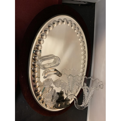 33 - A PAIR OF OVAL MIRRORS WITH VELVET BACKGROUND AND GLASS SCONCE DETAIL (A/F)