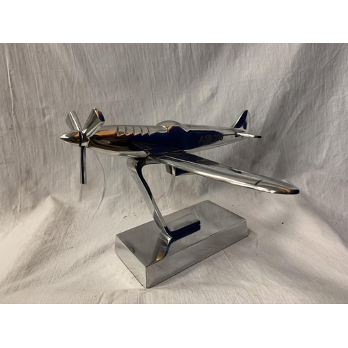 54 - A CHROME MODEL A58-303 AEROPLANE ON A PLINTH OF THE SAME H:23CM