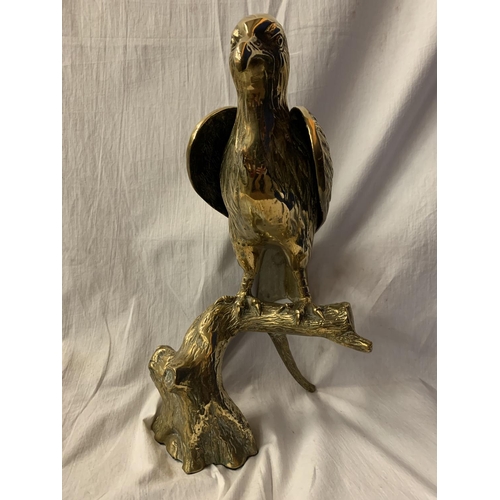 58 - A LARGE BRASS SCULPTURE OF A BIRD OF PREY - 39CM HIGH