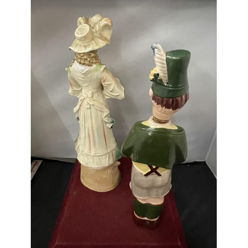 117 - A GERMAN BISC FIGURINE IN THE FORM OF A LADY AND A DECANTER IN THE FORM OF A GERMAN BOY (HAT A/F)