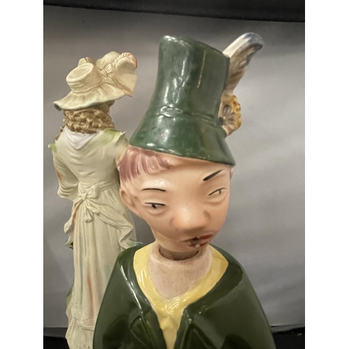 117 - A GERMAN BISC FIGURINE IN THE FORM OF A LADY AND A DECANTER IN THE FORM OF A GERMAN BOY (HAT A/F)