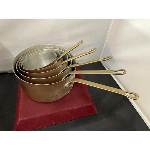 121 - FIVE COPPER SAUCEPANS OF VARIOUS SIZES