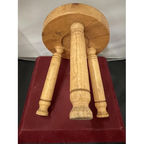 122 - A SMALL WOODEN THREE LEGGED MILKING STOOL H- 22CM DIA -18CM