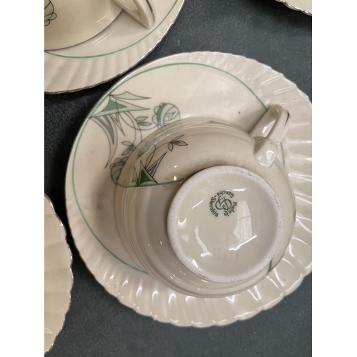 126 - AN ART DECO TEA SET COMPRISING OF CUPS, SAUCERS, MILK JUG AND SUGAR BOWL