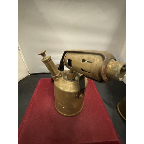 135 - A PAIR OF BRASS BLOW LAMPS