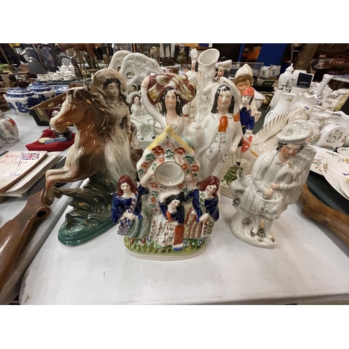 167 - A LARGE COLLECTION OF VARIOUS STAFFORDSHIRE FLATBACK FIGURES