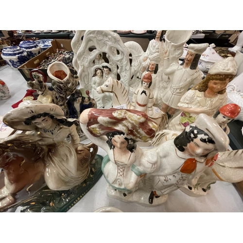 167 - A LARGE COLLECTION OF VARIOUS STAFFORDSHIRE FLATBACK FIGURES