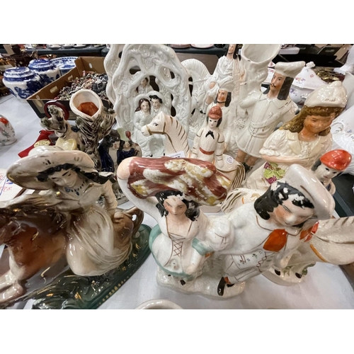 167 - A LARGE COLLECTION OF VARIOUS STAFFORDSHIRE FLATBACK FIGURES