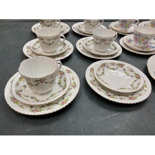 281 - TWO CHINA PART TEA SETS TO INCLUDE TRIOS, MILK JUG, SUGAR BOWL ETC