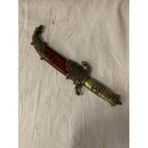 81 - AN ORNATE SHEATHED MIDDLE EASTERN DAGGER