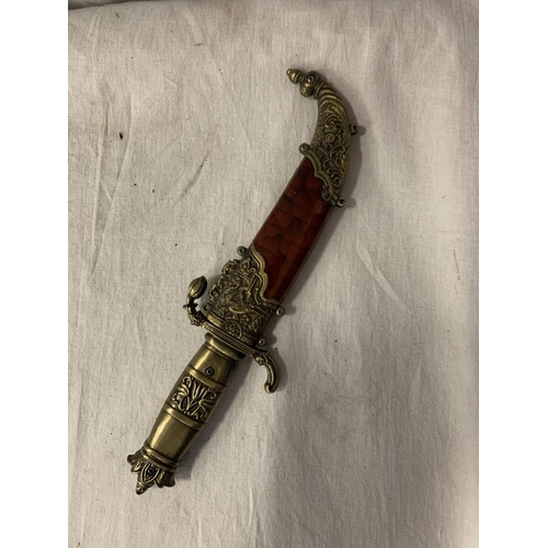 81 - AN ORNATE SHEATHED MIDDLE EASTERN DAGGER