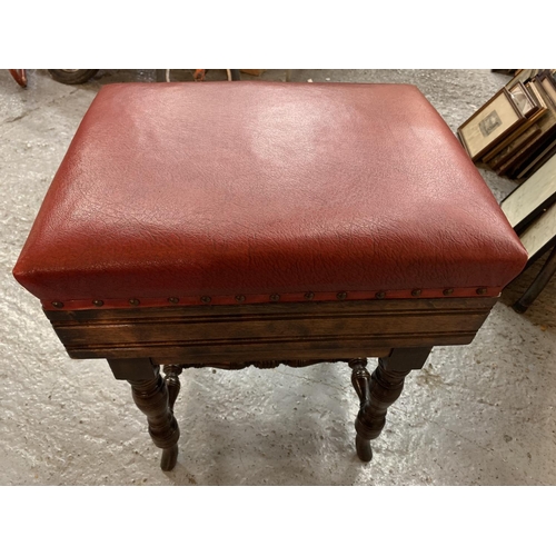 180 - A VICTORIAN OAK ADJUSTABLE PIANO STOOL WITH RED LEATHER SEAT