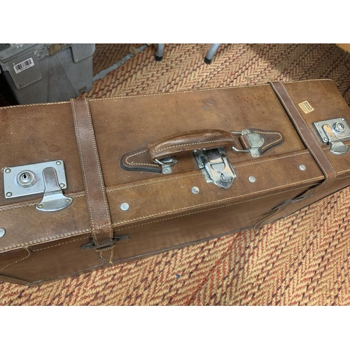 249 - A LARGE VINTAGE BROWN LEATHER SUITCASE WITH CHROME FITTINGS